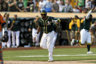 Oakland Athletics' Elvis Andrus collapses with an injury after scoring against the Houston Astros in the ninth inning of a baseball game in Oakland, Calif., Saturday, Sept. 25, 2021. The Athletics won 2-1. (AP Photo/John Hefti)