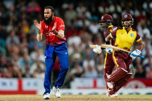 Adil Rashid  (left) in action for England