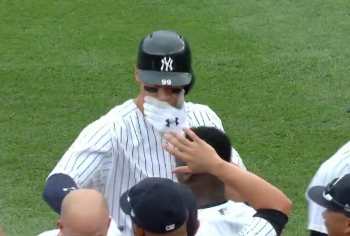 Aaron Judge protected his teeth at all cost during the Yankees walk-off celebration on Saturday. (MLB.TV)