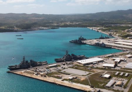 FILE PHOTO: Navy vessels are moored in port at the U.S. Naval Base Guam at Apra Harbor, Guam March 5, 2016. Major Jeff Landis,USMC (Ret.)/Naval Base Guam/Handout/File Photo via REUTERS