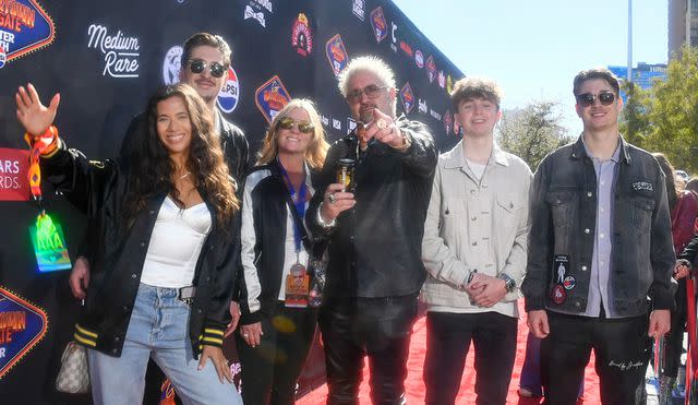 <p>Mindy Small/Getty</p> (L-R) Tara Bernstein, Hunter Fieri, Lori Fieri, Guy Fieri, Ryder Fieri and guest arrive at Guy Fieri's Flavortown Tailgate on February 11, 2024