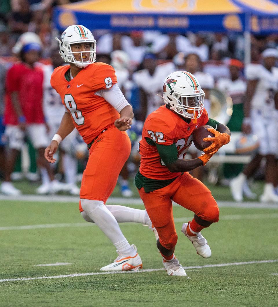 FAMU running back and former Rickards player De'Andre Francis takes a hand off from QB Jeremy Moussa in the Rattlers' 23-13 home win over Albany State on Saturday, Sept. 10, 2022.