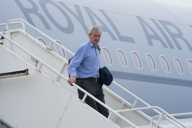 Ambassador to Afghanistan Sir Laurie Bristow exits a plane upon its arrival at RAF Brize Norton base in Oxfordshire after being evacuated from Kabul