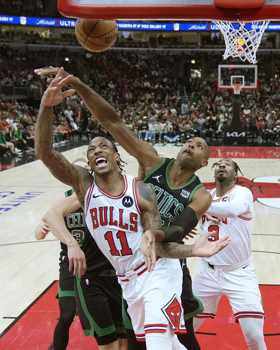 Boston Celtics' Al Horford, center right, blocks a shot by Chicago Bulls' DeMar DeRozan (11) during the first half of an NBA basketball game Thursday, Feb. 22, 2024, in Chicago. (AP Photo/Charles Rex Arbogast)