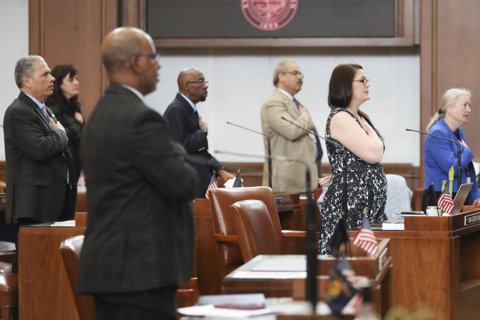 Democratic senators stand for the Pledge of Allegiance during a Senate session at the Oregon State Capitol in Salem, Ore., Thursday, May 4, 2023. Four Republican senators and one Independent senator had unexcused absences, preventing a quorum for the second day. (AP Photo/Amanda Loman)