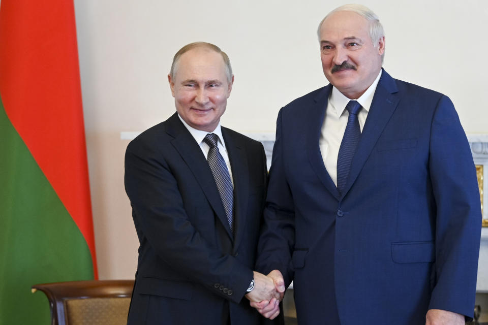 FILE - Russian President Vladimir Putin, left, and Belarusian President Alexander Lukashenko pose for a photo during their meeting in St. Petersburg, Russia, Tuesday, July 13, 2021. For most of his 27 years as the authoritarian president of Belarus, Alexander Lukashenko has disdained democratic norms, making his country a pariah in the West and bringing him the sobriquet of “Europe’s last dictator." Now, his belligerence is directly affecting Europe. (Alexei Nikolsky, Sputnik, Kremlin Pool Photo via AP, File)