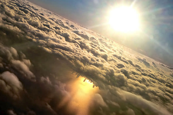 Chicago taken from a plane window shows the city beautifully reflected in Lake Michigan