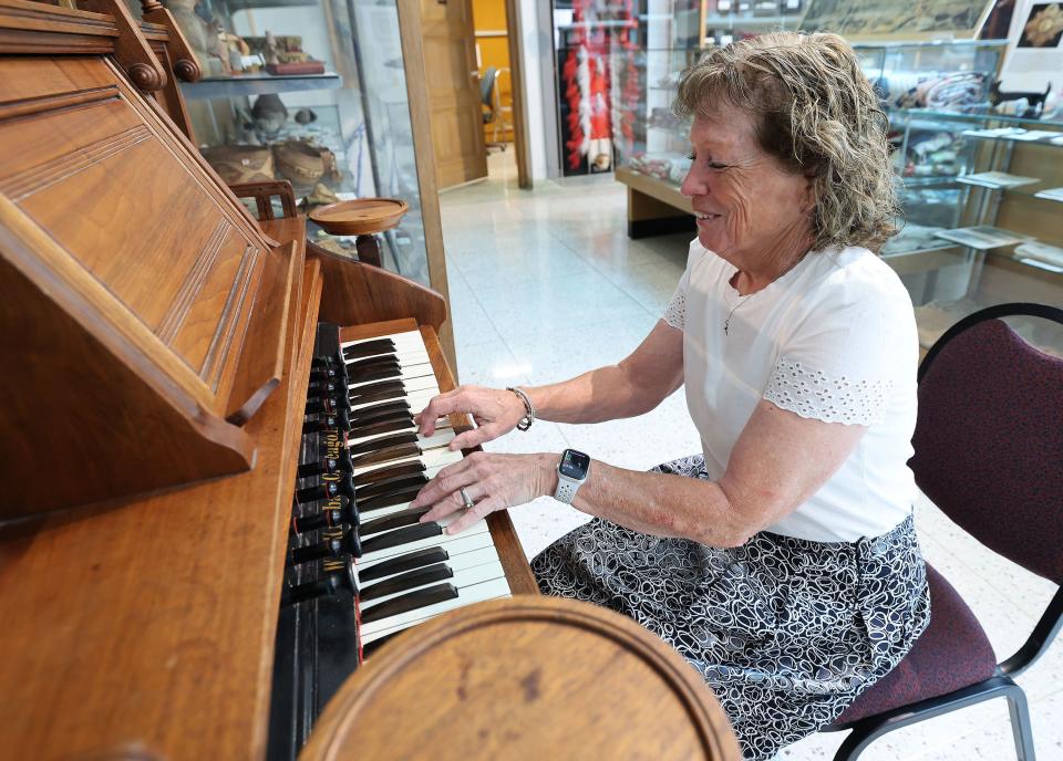 Ellen Jeppson, Pioneer Memorial Museum president, plays a 1870 pump organ on display at the museum in Salt Lake City on Friday, July 14, 2023. | Jeffrey D. Allred, Deseret News