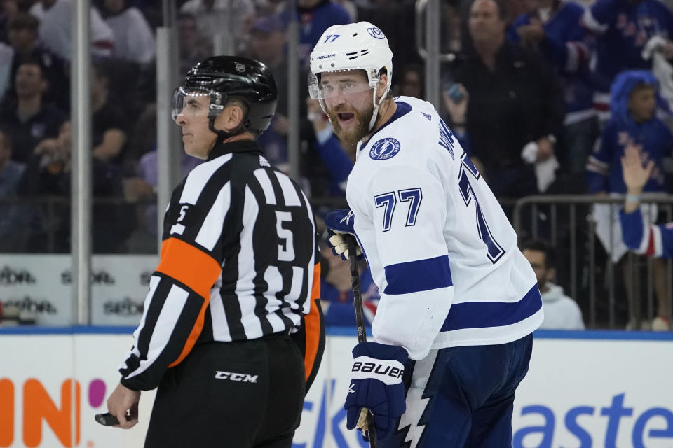 Tampa Bay Lightning defenseman Victor Hedman (77) argues with referee Chris Rooney (5) after being given a two minute penalty for tripping in the third period of Game 2 of the NHL hockey Stanley Cup playoffs Eastern Conference finals, Friday, June 3, 2022, in New York. (AP Photo/John Minchillo)