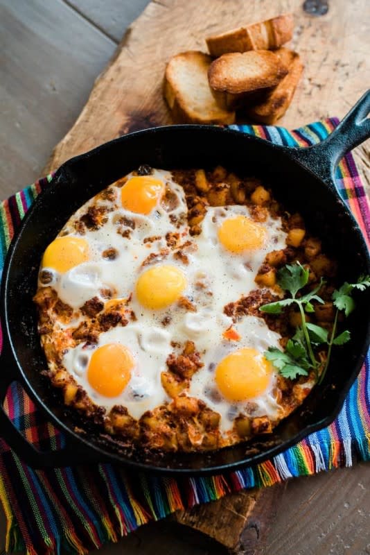 <p>Get the recipe: <a href="https://muybuenocookbook.com/baked-eggs-with-chorizo-and-potatoes/" rel="nofollow noopener" target="_blank" data-ylk="slk:Baked Eggs with Chorizo and Potatoes;elm:context_link;itc:0;sec:content-canvas" class="link "><strong>Baked Eggs with Chorizo and Potatoes</strong></a></p><p><strong>Related: <a href="https://parade.com/17235/jessicasmith/rise-and-shine-mini-breakfast-casseroles/" rel="nofollow noopener" target="_blank" data-ylk="slk:The Best Mini Breakfast Casseroles;elm:context_link;itc:0;sec:content-canvas" class="link ">The Best Mini Breakfast Casseroles</a></strong></p>