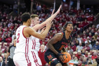 Maryland's Julian Reese (10) looks to shoot against Wisconsin's Jordan Davis (2) and Tyler Wahl, center, during the first half of an NCAA college basketball game Tuesday, Dec. 6, 2022, in Madison, Wis. (AP Photo/Andy Manis)