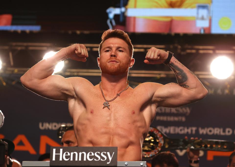 Canelo Alvarez poses on the scale during his official weigh-in at MGM Grand Garden Arena (Getty)