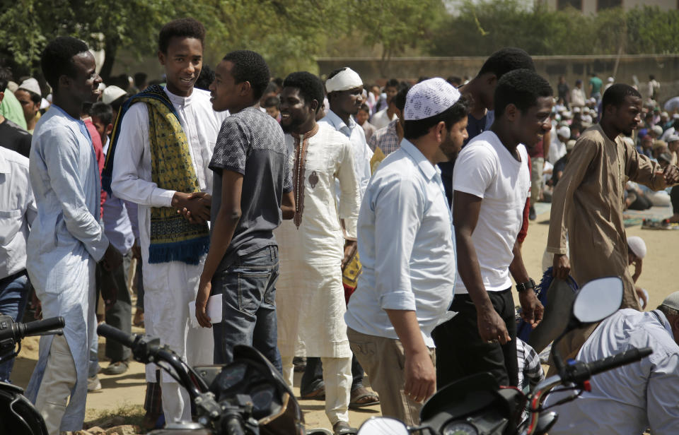 In this Thursday, March 30, 2017 photo, African students greet each other after Friday prayers in Greater Noida, India. Tens of thousands of Africans live and study in India, and newly built suburbs like Greater Noida especially draw students because they are home to several sprawling private universities. But prejudice and racism are near-constants for Africans in the country. (AP Photo/Altaf Qadri)