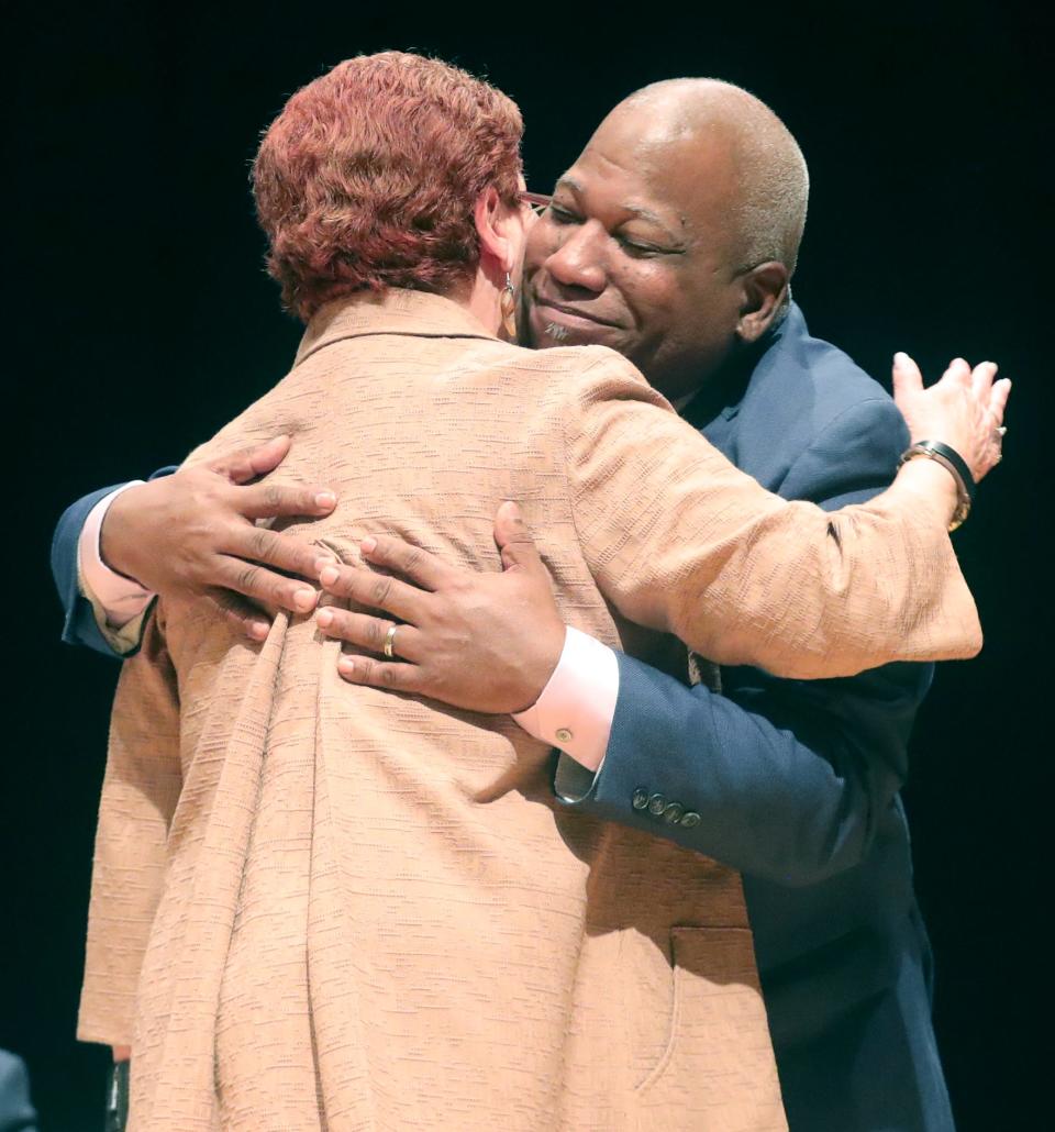 Omar Banks hugs Summit County Executive Eileen Shapiro after her speech nominating him to be reelected second vice chair of the Summit County Democratic Party on Wednesday at North High School in Akron.