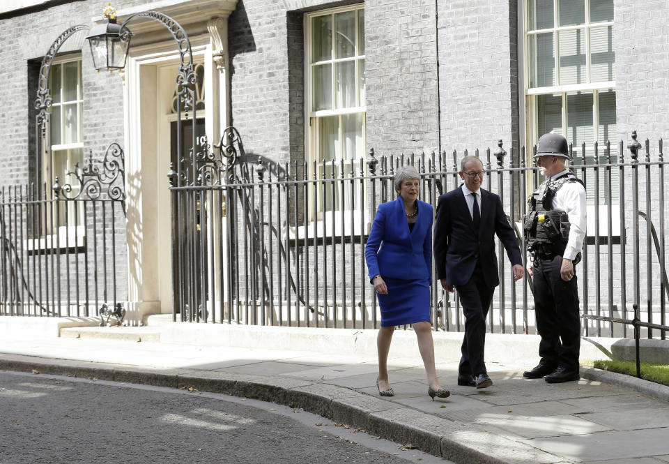 Britain's Prime Minister Theresa May leaves 10 Downing Street with her husband Philip May to visit Queen Elizabeth II, where she will officially resign as Prime Minister, in London, Wednesday, July 24, 2019. Boris Johnson will replace May as Prime Minister later Wednesday. (AP Photo/Tim Ireland)