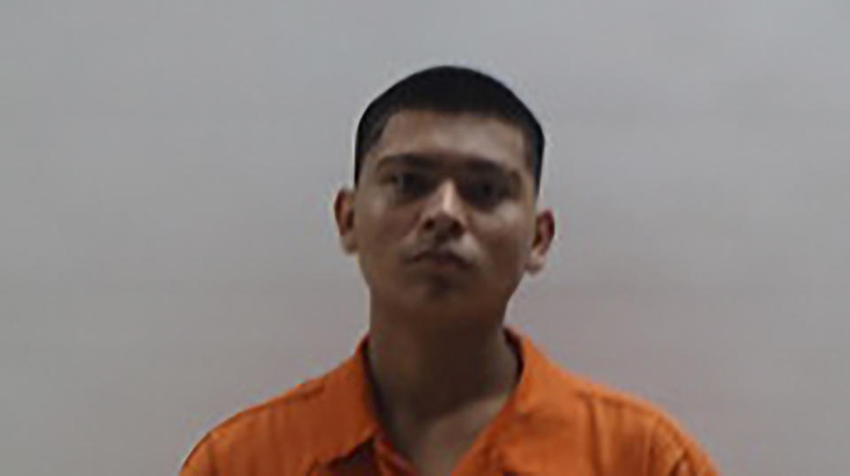 This booking photo provided by the Cameron County Sheriff's Department shows Rogelio Martinez Jr., 18, on Wednesday, Oct. 18, 2023. A South Texas police officer was fatally shot after he joined an hourslong pursuit of two men who fled a traffic stop and led officers on a chase through several cities before they were arrested, authorities said. The two suspects — Martinez of Brownsville and Rodrigo Axel Espinosa Valdez of Mexico are facing multiple charges including capital murder, aggravated assault with a deadly weapon and evading arrest. (Cameron County Sheriff's Department via AP)