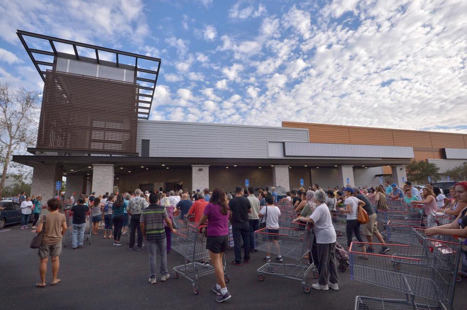 People line up with empty shopping carts to get in for the grand opening event of the Costco, the main anchor of the Village at Westfield Topanga. Woodland Hills, CA 912/2015