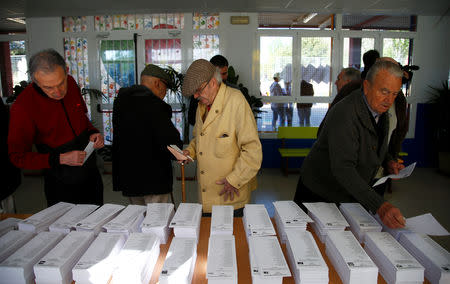 People are seen at a polling station during Spain's general election in Madrid, Spain, April 28, 2019. REUTERS/Javier Barbancho