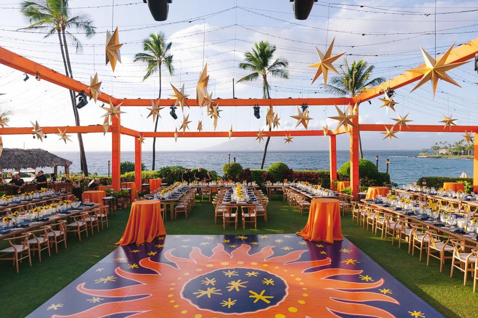 Our star and sun-filled reception. The sun on our dance floor was drawn by Bernard Maisner and matched the one he drew for our invitation.