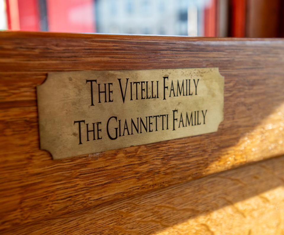 A plaque on a booth inside the Moran Square Diner honors previous owners.