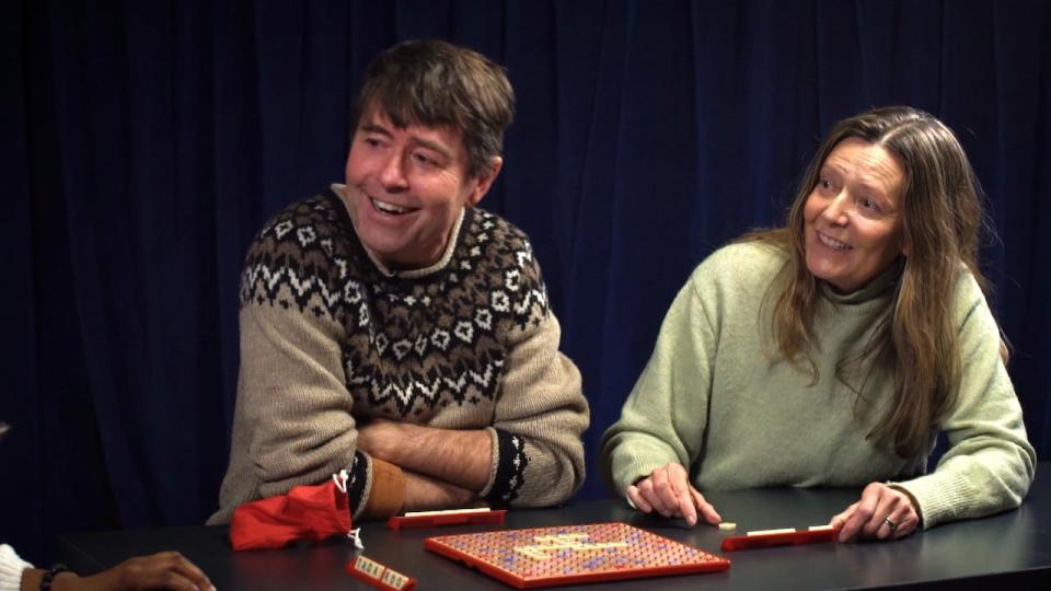 Holly Hogan and Michael Crummey play Scrabble.