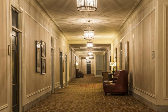 A long hallway in an old hotel