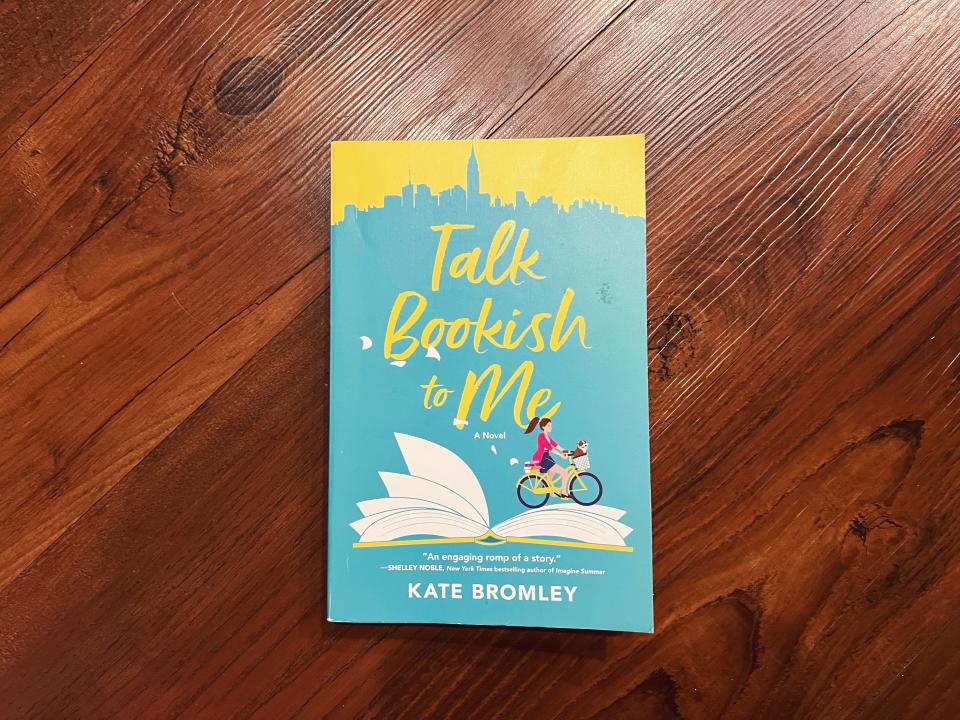 Book "Talk Bookish to Me" by Kate Bromley on a wooden surface