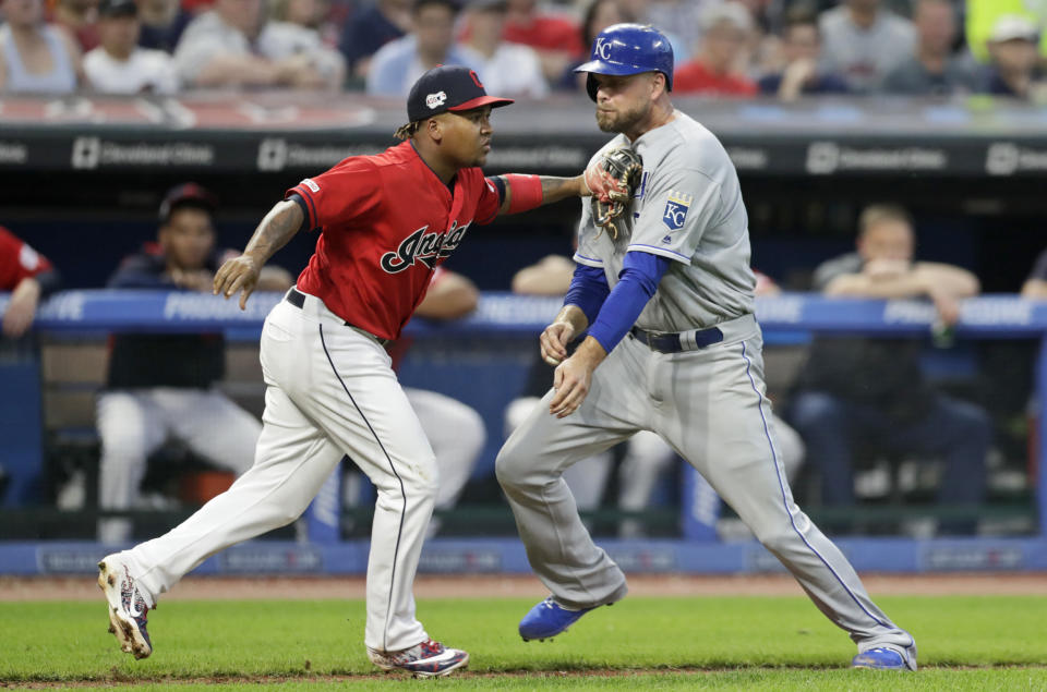 Kansas City Royals' Lucas Duda, right, is tagged out by Cleveland Indians' Jose Ramirez in a rundown at home in the sixth inning in a baseball game, Tuesday, June 25, 2019, in Cleveland. (AP Photo/Tony Dejak)