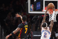 Oklahoma City Thunder guard Shai Gilgeous-Alexander scores past Atlanta Hawks guard Jarrett Culver during the second half of an NBA basketball game, Monday, Dec. 5, 2022, in Atlanta. (AP Photo/Hakim Wright Sr.)