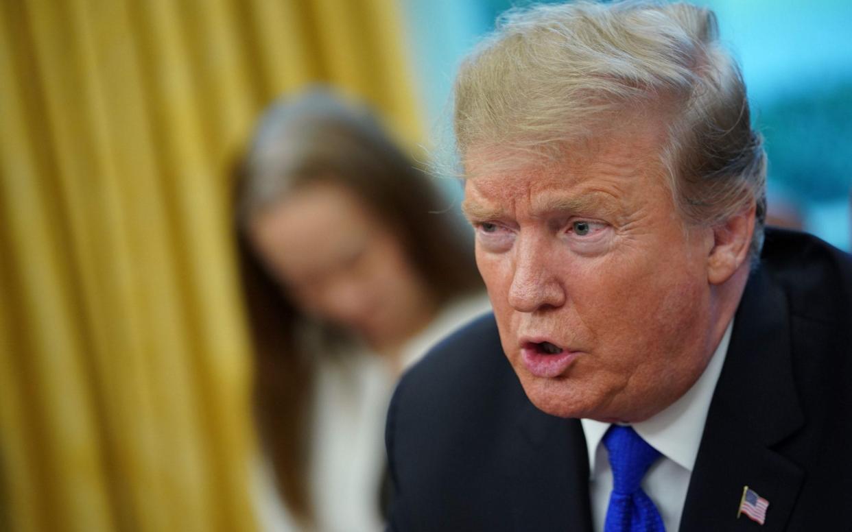 Donald Trump speaks during a meeting with Chinese Vice Premier Liu He in the Oval Office of the White House - AFP