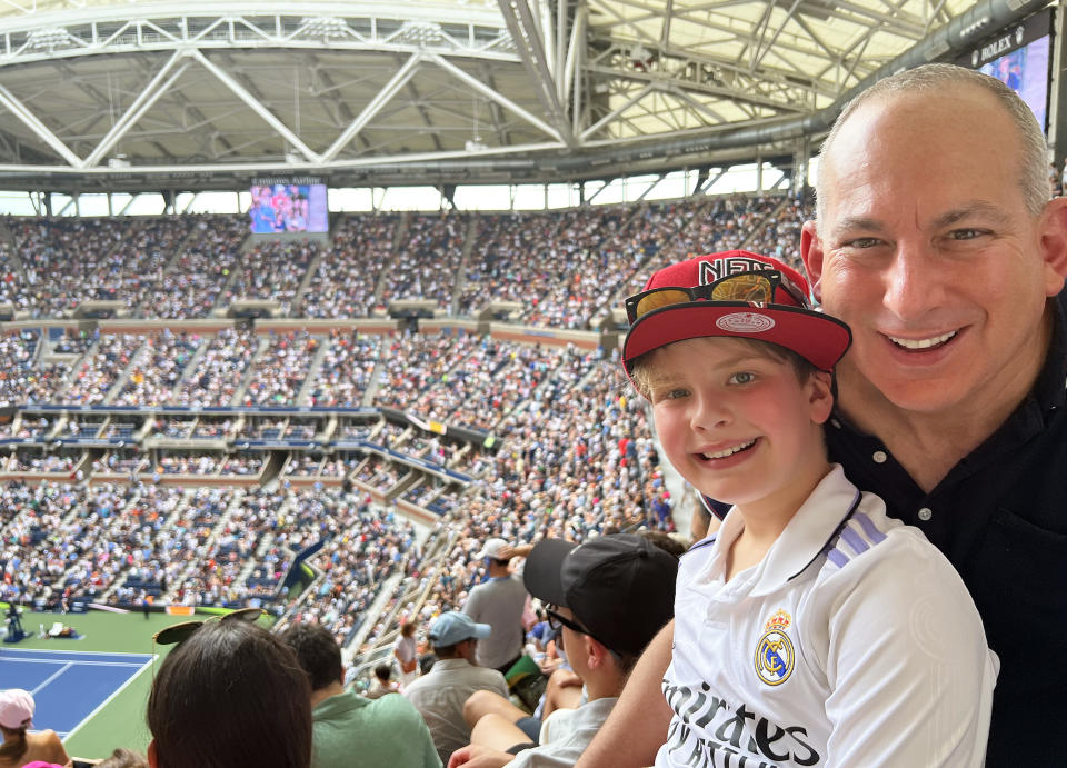 My husband, Jack, with our son, Lucas, at the U.S. Open. (Courtesy Bradley Jacobs Sigesmund)