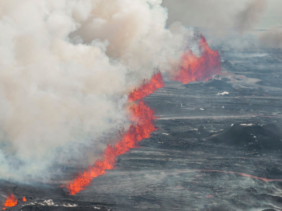 An eruptive fissure spews lava and smoke from a volcano in Grindavik, Iceland, Wednesday, May 29, 2024. A volcano in southwestern Iceland erupted Wednesday for the fifth time since December, spewing red lava that once again threatened the coastal town of Grindavik and led to the evacuation of the popular Blue Lagoon geothermal spa. (AP Photo/Marco di Marco)