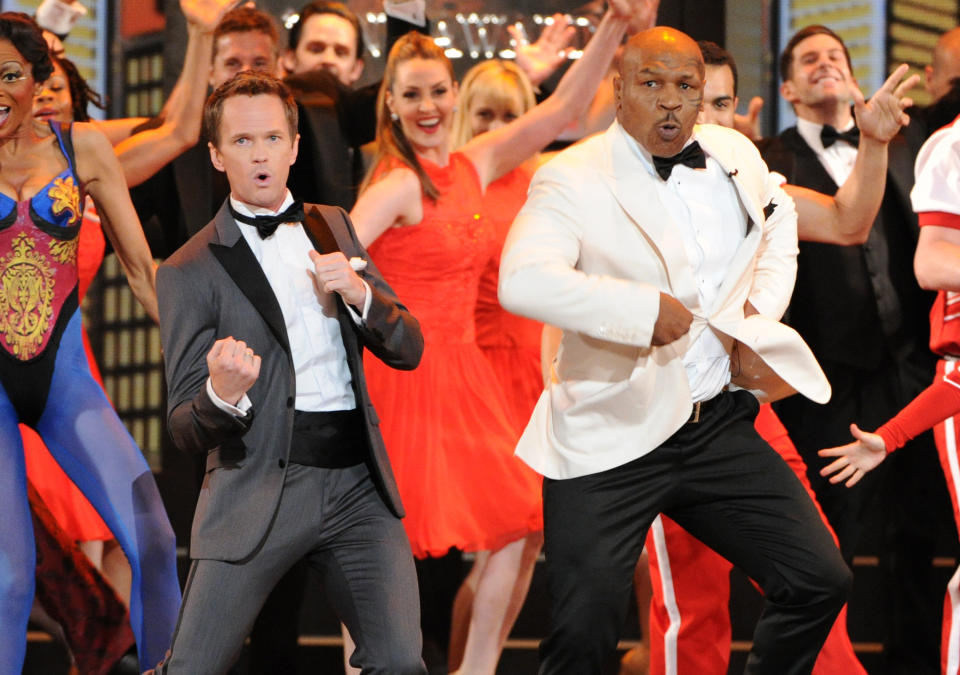 Actor Neil Patrick Harris, left, and Mike Tyson perform on stage at the 67th Annual Tony Awards, on Sunday, June 9, 2013 in New York. (Photo by Evan Agostini/Invision/AP)