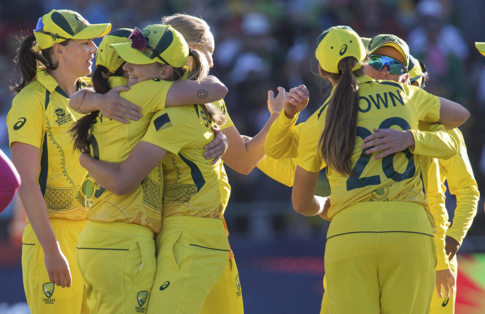 Australia players celebrate winning the Women's T20 World Cup semi final cricket match between South Africa and Australia, in Cape Town, South Africa, Sunday Feb. 26, 2023. (AP Photo/Halden Krog)