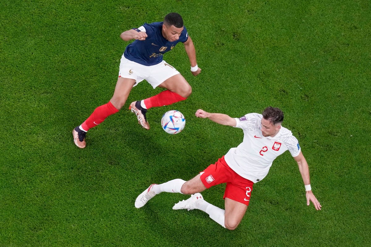 Kylian Mbappe gave Matty Cash the run-around in France’s 3-1 win over Poland (Thanassis Stavrakis/AP) (AP)