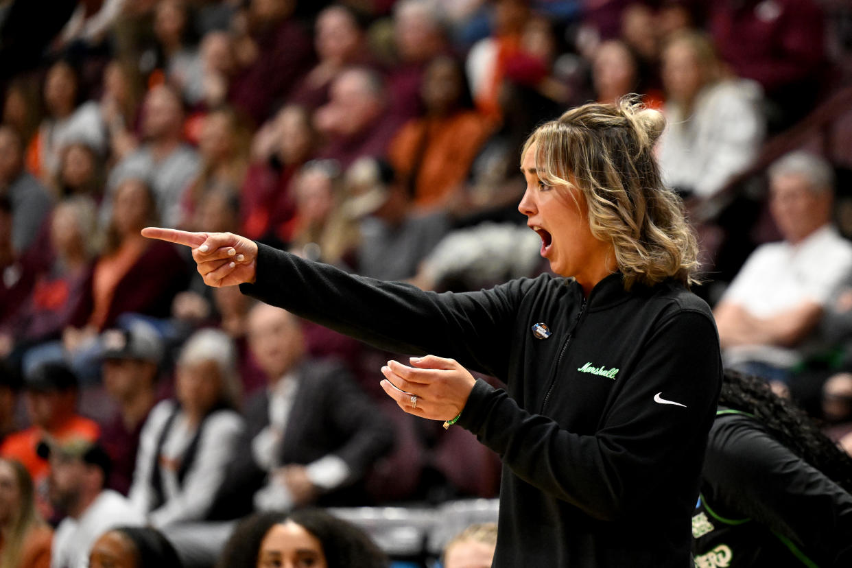 BLACKSBURG, VIRGINIA - MARCH 22: Head coach Kim Caldwell of the Marshall Thundering Herd talks to her players during the first quarter of a game against the Virginia Tech Hokies during the first round of the 2024 NCAA Women's Basketball Tournament held at Cassell Coliseum on March 22, 2024 in Blacksburg, Virginia. (Photo by Greg Fiume/NCAA Photos via Getty Images)