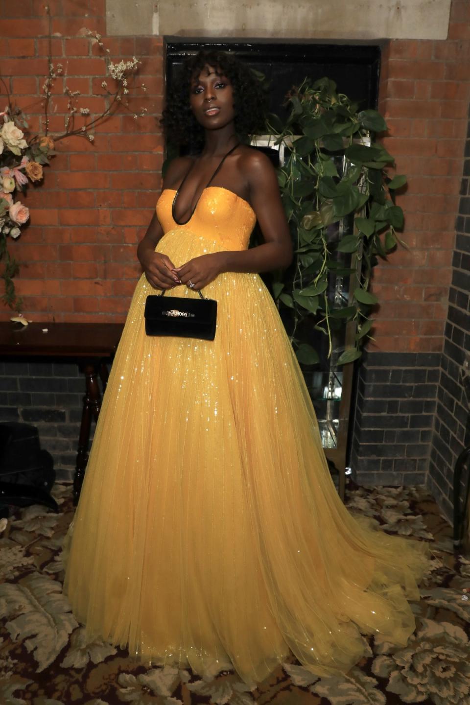 Turner-Smith in canary yellow form at the 2020 Baftas (Getty Images for Netflix)