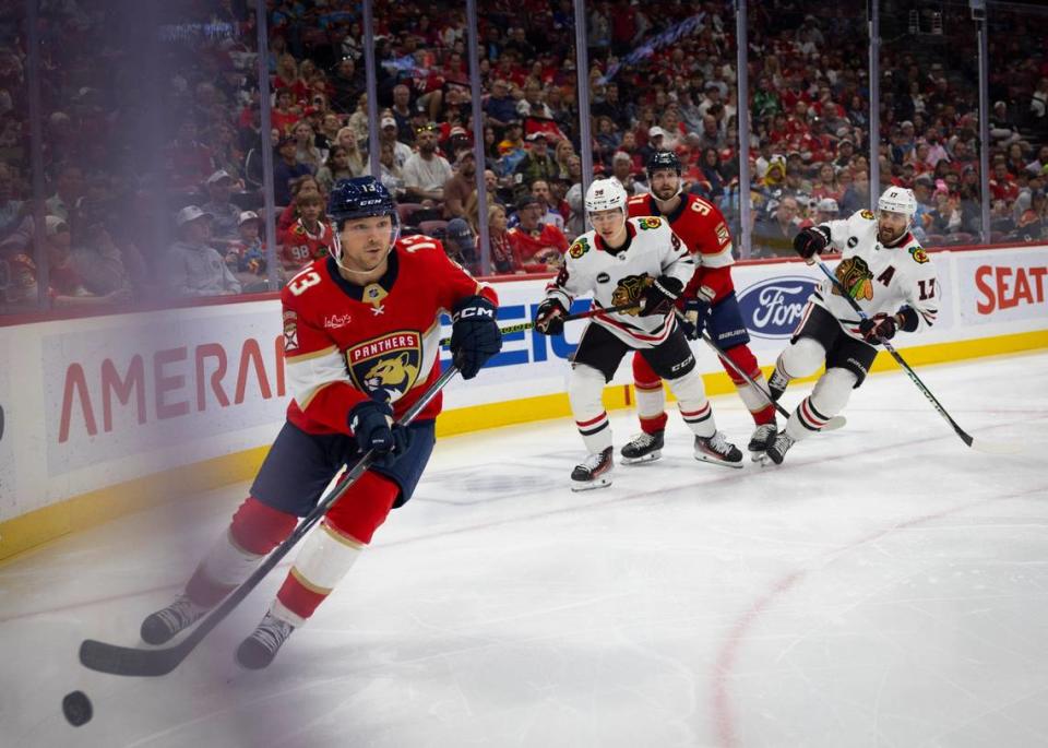 Florida Panthers center Sam Reinhart (13) looks for an open teammate during the first period of an NHL game against the Chicago Blackhawks at the Amerant Bank Arena on Sunday, Nov 12, 2023, in Sunrise, Fla.