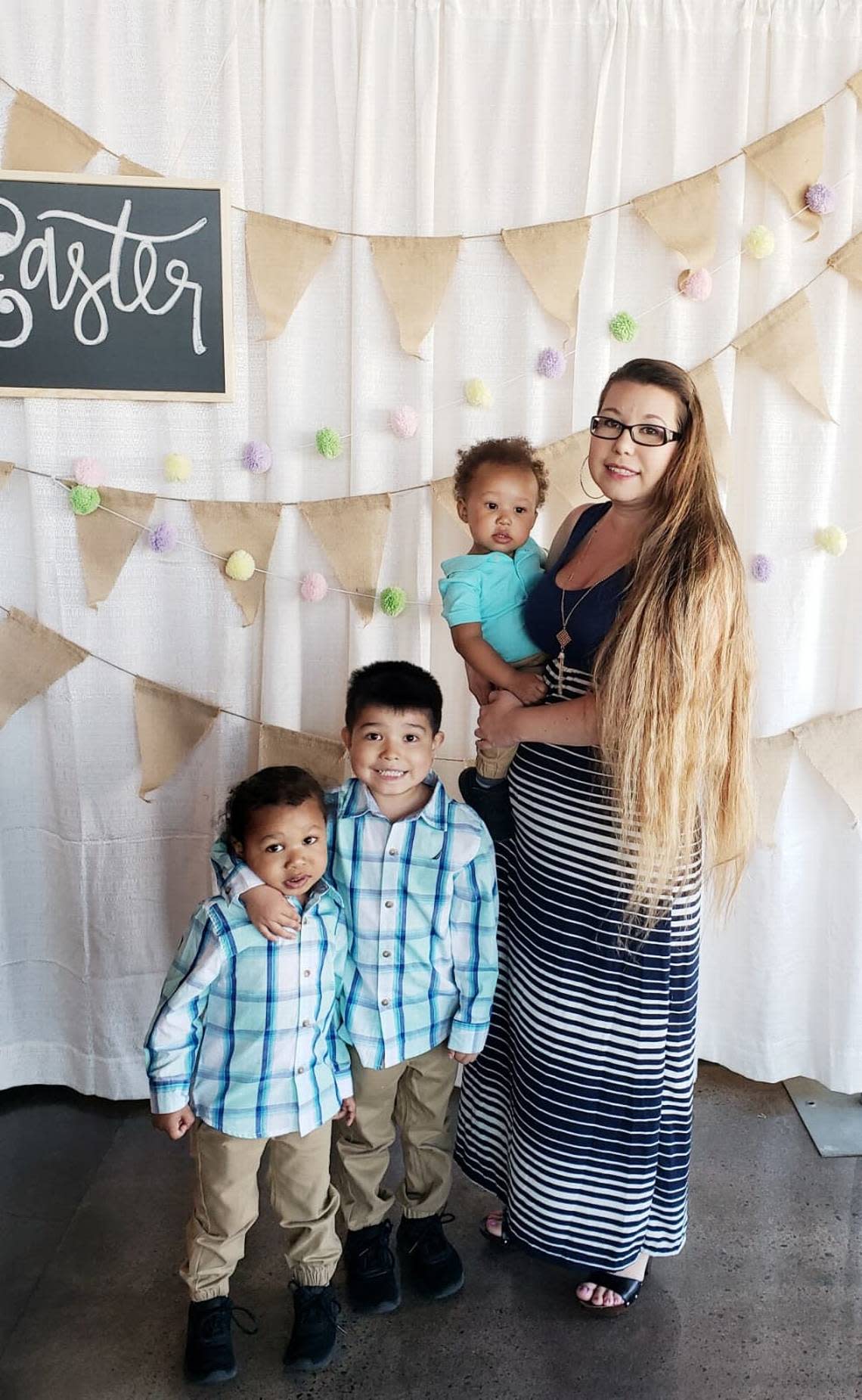 Omari Garcia is being held by his mother, Diocelina Garcia, and alongside his older brothers in a 2019 Easter Sunday photo. Omari drowned in a south Wichita swimming pool on Tuesday.