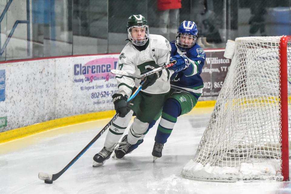 Rice's Jackson Strong circles his net as Colchester's Brody Rassel chases from behind during the Green Knights' loss to the Lakers at Cairns Arena during the 2022-23 season.