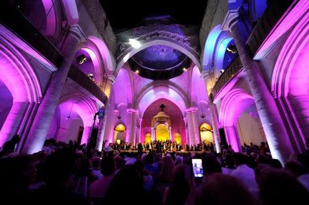 People attend a classical concert in the war-torn Maronite cathedral at the Old City of Aleppo, Syria July 11, 2017. REUTERS/Omar Sanadiki