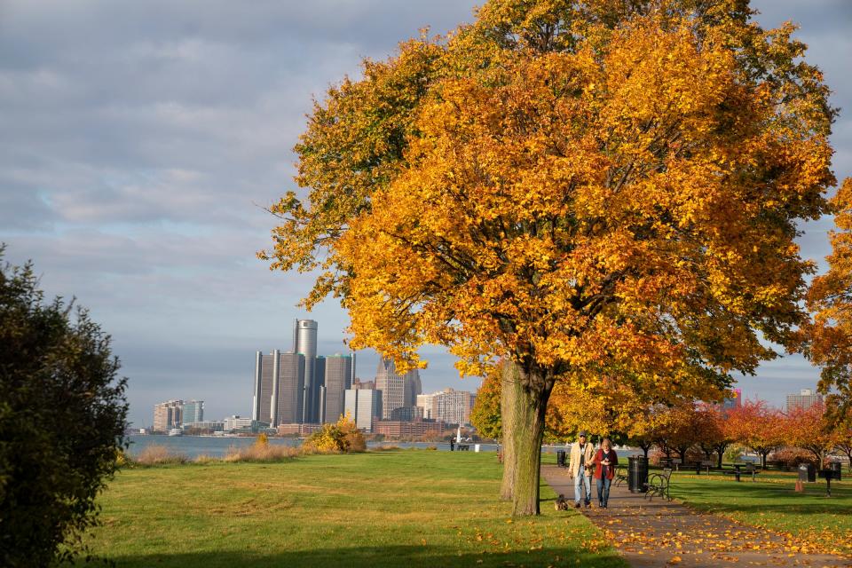 Charles Thompson, 80, of Detroit, and his wife, Barbara Thompson, 70, walk Coco, their 12-year-old Shi Tzu yorkie mix on Belle Isle in Detroit on Friday, Oct. 27, 2023.