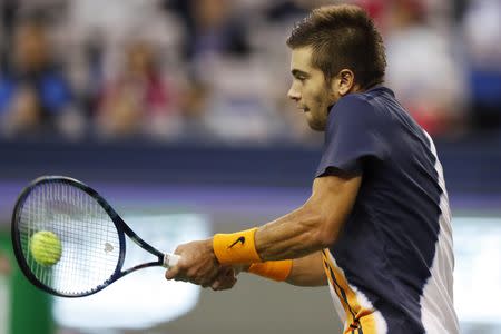 Tennis - Shanghai Masters - Men's Singles - Final - Qi Zhong Tennis Center, Shanghai, China - October 14, 2018. Borna Coric of Croatia in action against Novak Djokovic of Serbia. REUTERS/Aly Song