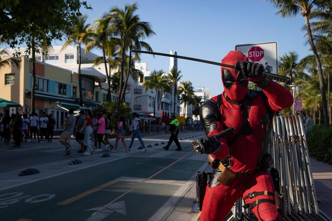 A creator called the Flash Pool swings his swords during spring break on Sunday, March 17, 2024, down Ocean Drive in South Beach. “I just wanted to come out here and do something positive for me,” said Flash Pool.