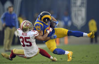 <p>Los Angeles Rams tight end Derek Carrier, right, is tackled by San Francisco 49ers strong safety Eric Reid during the second half of an NFL football game, Sunday, Dec. 31, 2017, in Los Angeles. (AP Photo/Mark J. Terrill) </p>