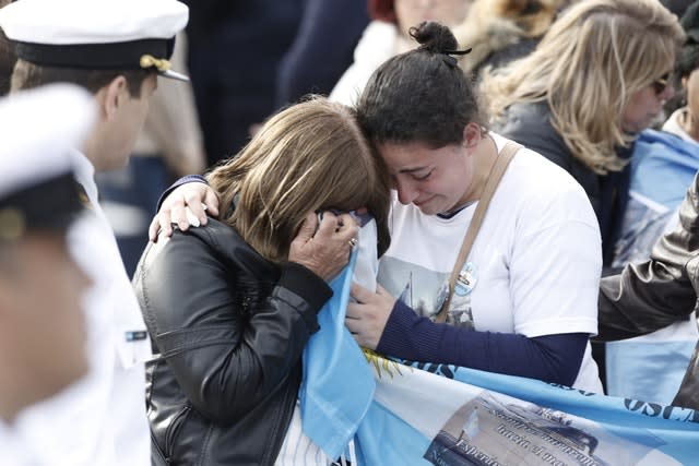 Relatives of the crew of the ARA San Juan embrace in mourning after a ceremony remembering the one year anniversary of the disappearance of the submarine