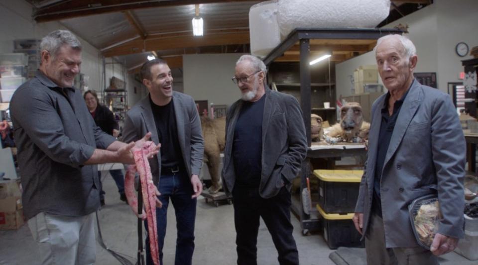 VAST Bank chairman Tom Biolchini, second from left, with monster maker Alec Gillis, left, Robert Englund and Lance Henriksen in a scene from “Mad Props,” at Studio Gillis in LA. Juan Pablo Reinoso