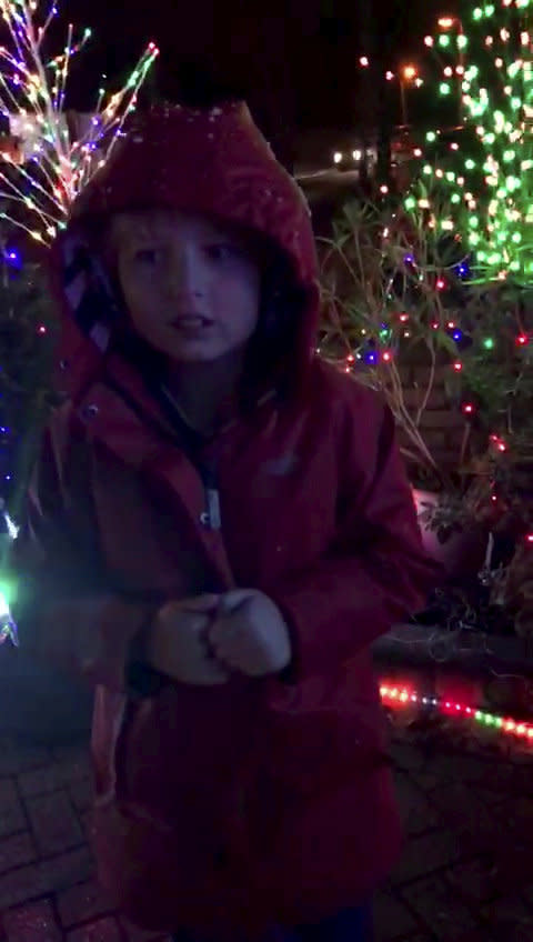 Incredible moment a non verbal nine-year-old said his first words - when he read out 'ho ho ho' spelled out by a Christmas light display