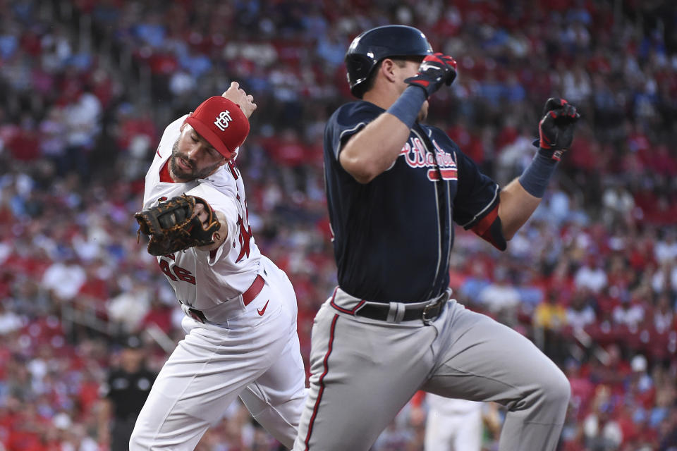 St. Louis Cardinals first baseman Paul Goldschmidt (46) tags out Atlanta Braves' Austin Riley (27) in the first inning of a baseball game on Friday, Aug. 26, 2022, in St. Louis. (AP Photo/Joe Puetz)