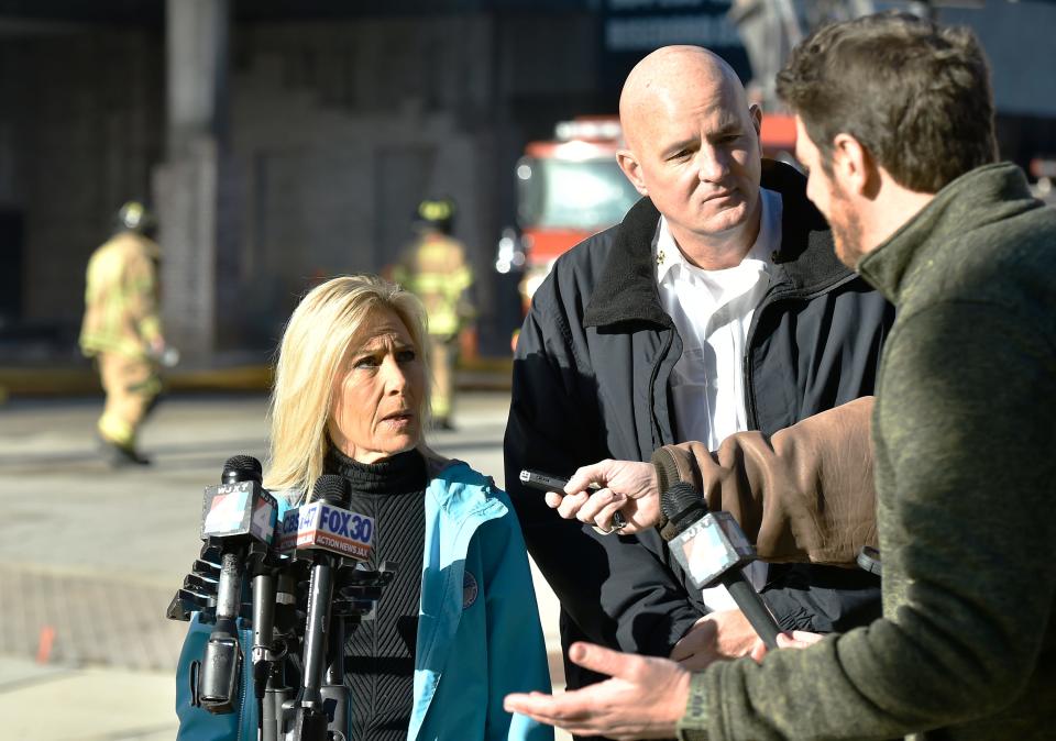 Jacksonville Mayor Donna Deegan and Fire and Rescue Department Chief Keith Powers talk with the media as crews try to extinguish the fire in the RISE Doro apartment building under construction downtown.